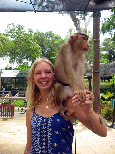 A picture of Fredrika with a monkey on her shoulder
